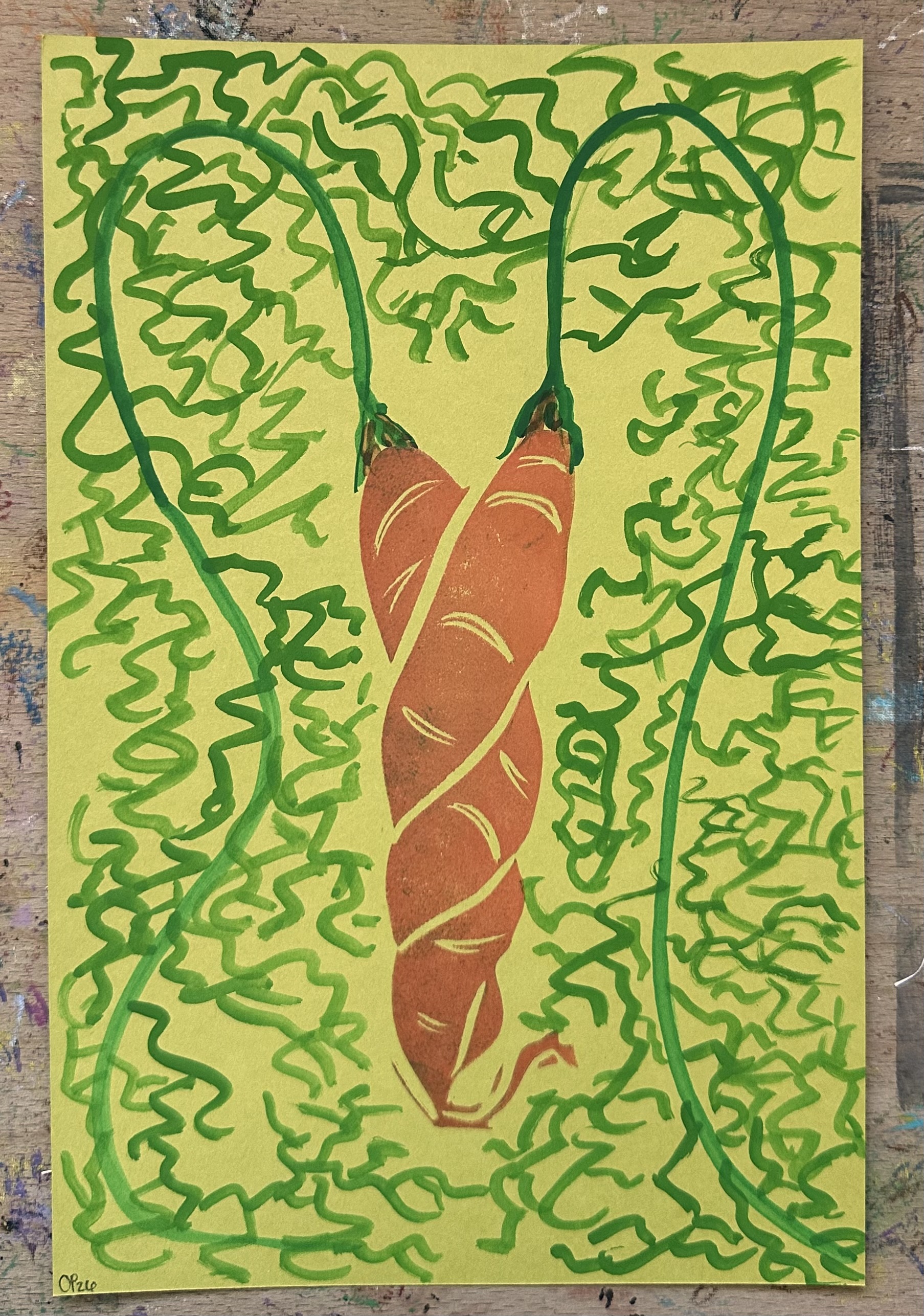 A light green rectangular piece of paper with a block print of two orange carrots intertwined in the center. Painted, coming from each, are their stems and leaves in green.