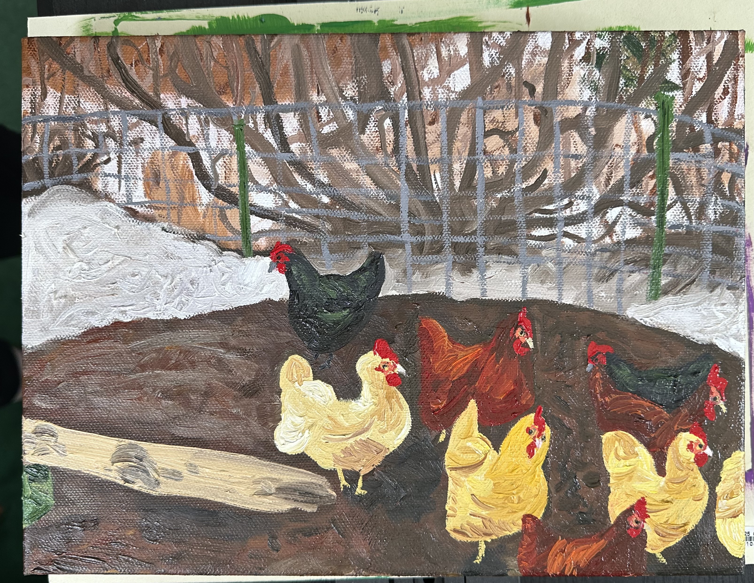 The front of a painting of a group of chickens mostly crowding around the bottom right. There are two black ones, four yellow ones, and three red ones - some are right at the edge. They stand in a muddy circle with a wooden ramp coming from the left. Behind them is snow and fencing with a tree and more snow and trees behind that.