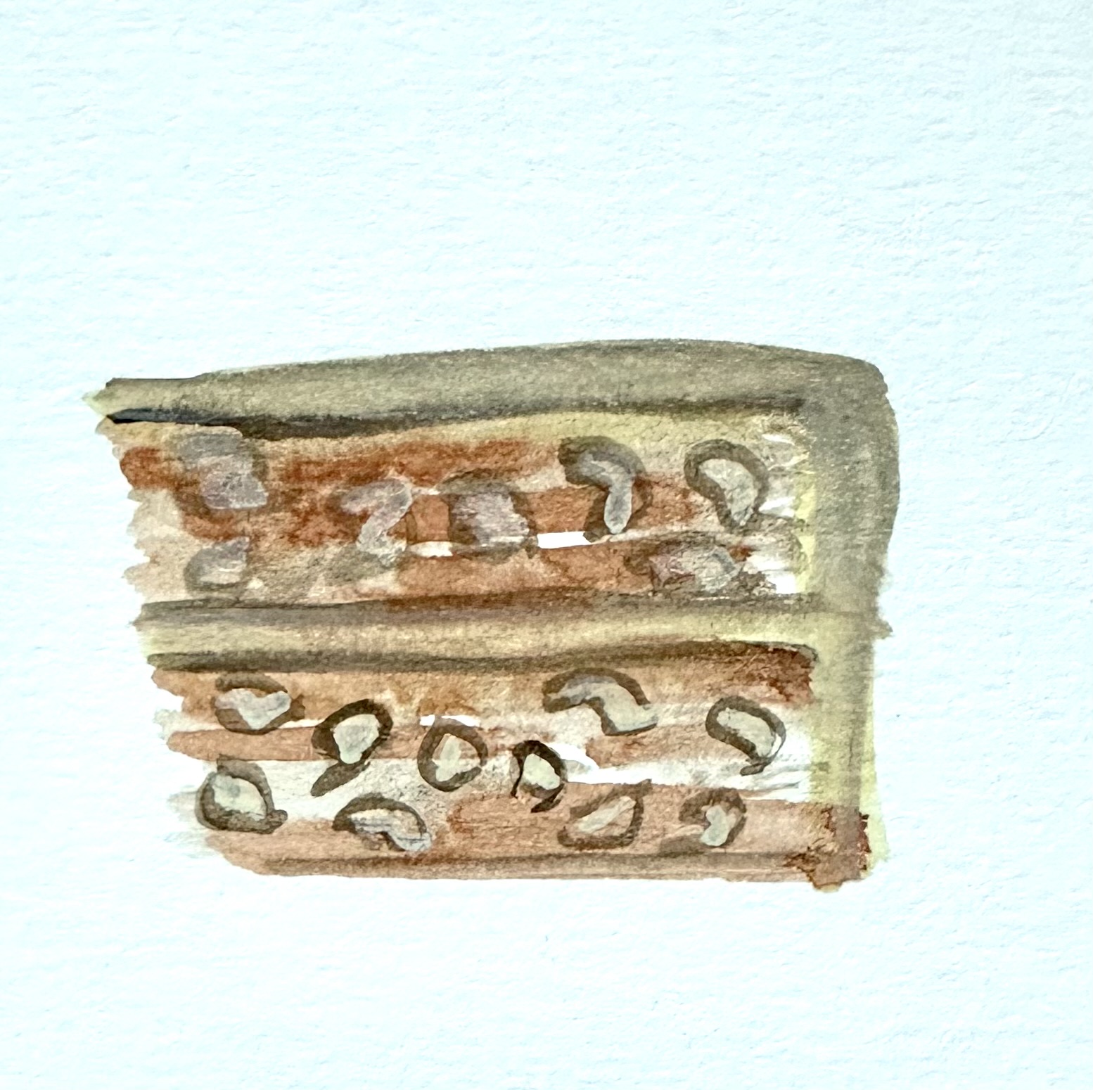 Watercolor illustration of a slice of two-layer cake with the frosting covered edge on the right. The frosting is a light brown. The cake is darker brown with blobs of lighter brown (supposed to be apples).
